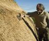 Using a legget to drive thatching in place